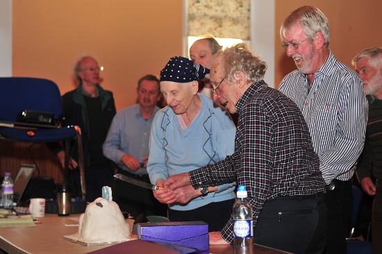 MBA Chairman, Simon Birch, watching Bernard and Betty cutting the cake (Photo: Richard Spencer, MBA)
