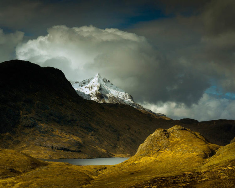 I shot this image in March on photographic expedition with a friend to Camasunary on the Isle of Skye. The path over to the isolated bothy from Kimarie isn't far as the crow flies but was grueling with a heavy pack and camera gear. The reward for the slog came at the highest point overlooking the bay between Slat bheinn and Beinn Leacach. A beautiful light was playing across Loch na Creitheach and there was a wonderful dusting of winter snow still hugging the pinnacle of Sgurr nan Gillean that re-invigorated my legs and soul.