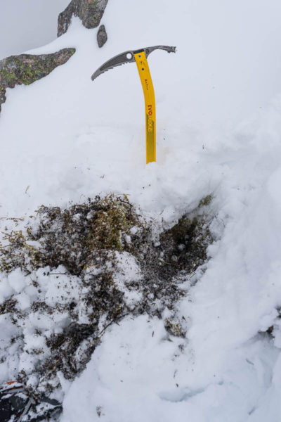 Prepping a comfort break on a snowy mountain, digging down past the snowline. Please note a T rated axe is not essential, although it can aid an effective brace position.