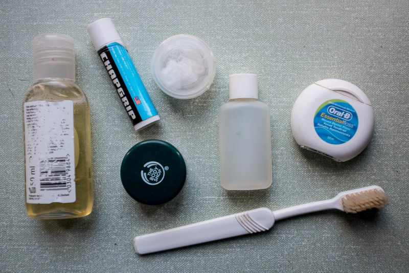 Clockwise from bottom: toothbrush (cut down not to save weight but to make it easier to pack), antiseptic cream (cuts and scrapes), organic peppermint soap concentrate (cleans cup, pan, spoon, me and my teeth), chapstick, concentrated handcream (for chapped hands and feet), liquid alcohol hand sanitiser, floss (for teeth and kit repair).
