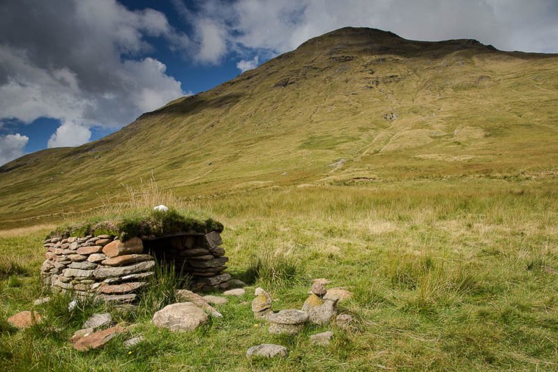 The house of the father, in the valley of the mother. 3 stones in front of the house represent the family.
